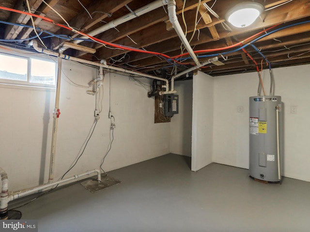 basement featuring electric water heater and electric panel