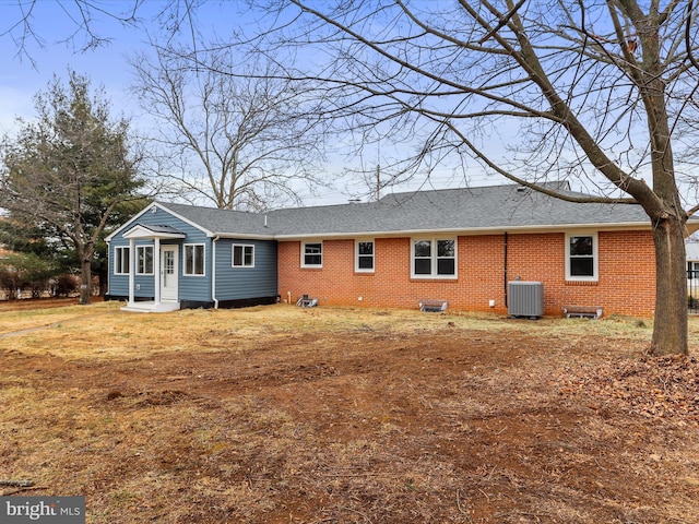 rear view of property featuring central air condition unit