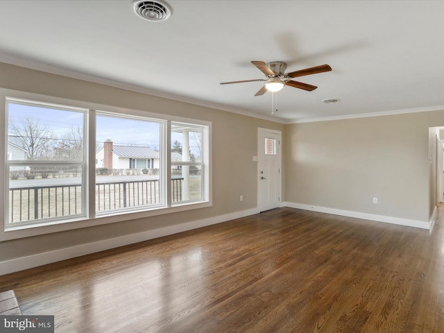 unfurnished room featuring crown molding, ceiling fan, and dark hardwood / wood-style floors