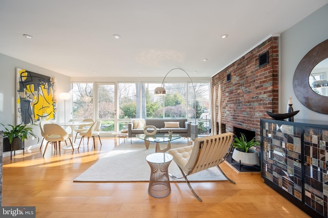 sunroom / solarium featuring a fireplace