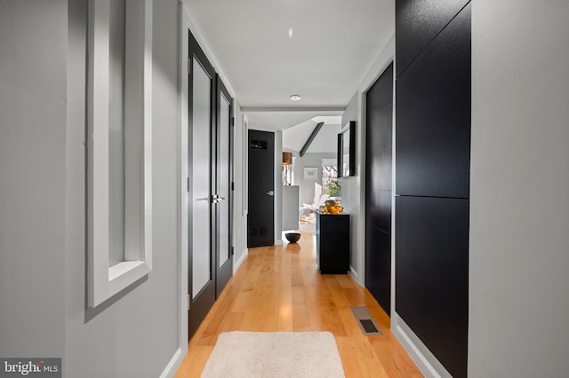 hall featuring light wood-type flooring