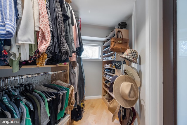 spacious closet with light hardwood / wood-style floors