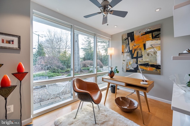 office space featuring ceiling fan and light hardwood / wood-style flooring