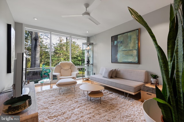 sunroom featuring ceiling fan