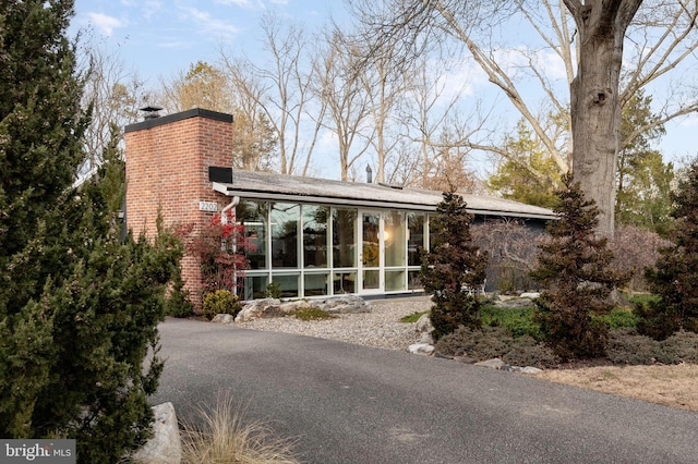 exterior space featuring a sunroom