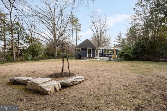 view of yard with a sunroom