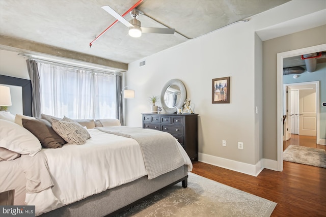 bedroom featuring ceiling fan and dark hardwood / wood-style flooring