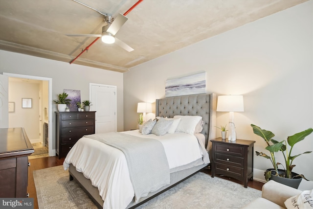 bedroom featuring hardwood / wood-style flooring, ceiling fan, and ensuite bathroom