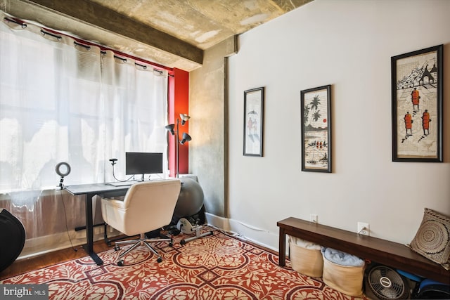 office area with hardwood / wood-style flooring and a healthy amount of sunlight