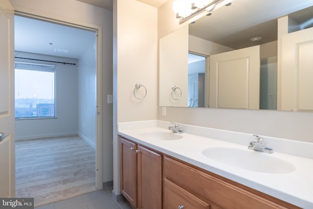 bathroom featuring tile patterned floors and vanity