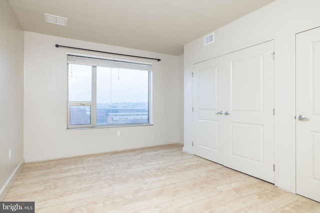 unfurnished bedroom with light hardwood / wood-style flooring