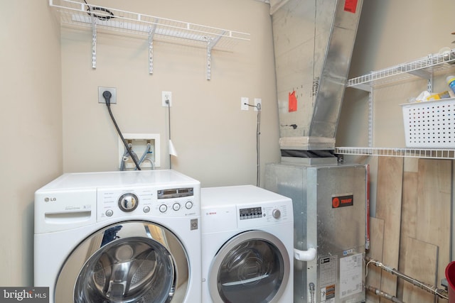 washroom featuring washing machine and dryer