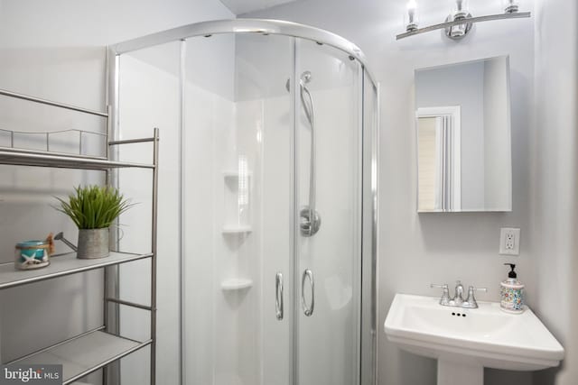 bathroom with sink and walk in shower