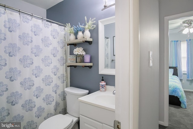 bathroom featuring ceiling fan, vanity, and toilet