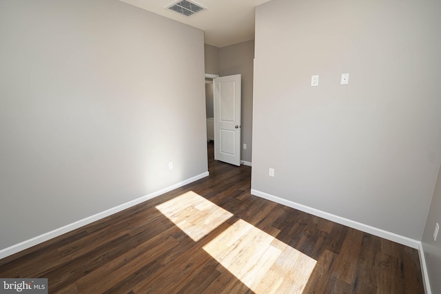 unfurnished bedroom featuring dark hardwood / wood-style floors