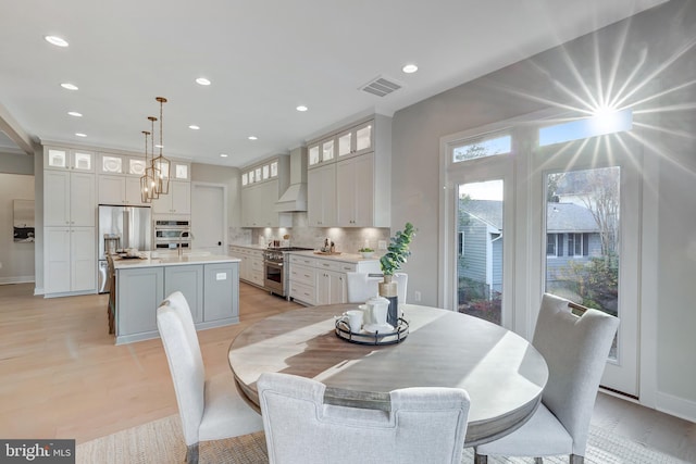 dining space featuring light hardwood / wood-style flooring