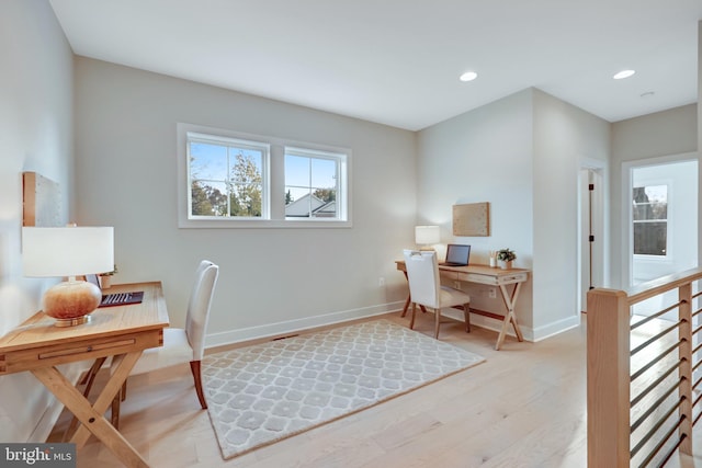 office space with light hardwood / wood-style flooring