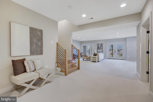 interior space with light colored carpet and french doors