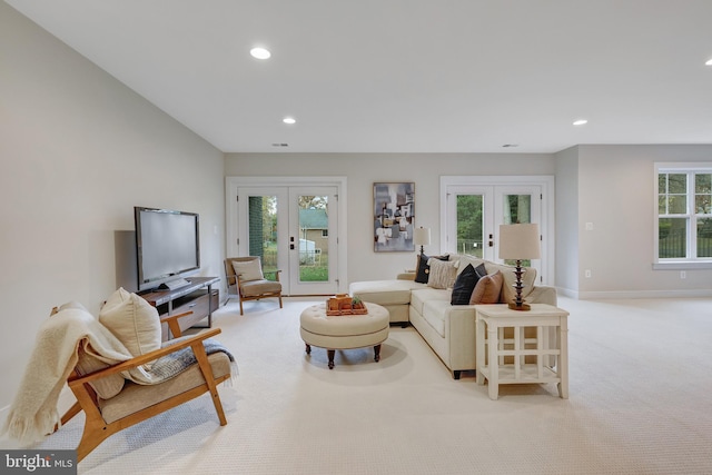 carpeted living room with french doors