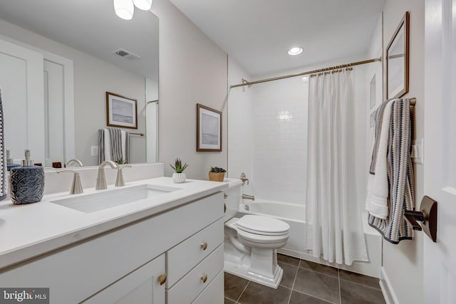 full bathroom featuring vanity, toilet, tile patterned flooring, and shower / tub combo