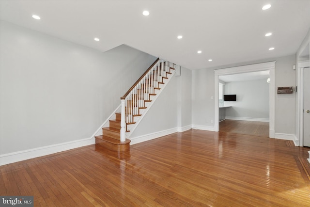 unfurnished living room featuring wood-type flooring