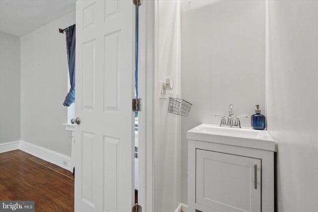 bathroom featuring hardwood / wood-style flooring and sink