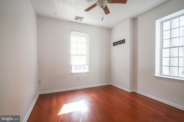 unfurnished room featuring dark hardwood / wood-style flooring and ceiling fan