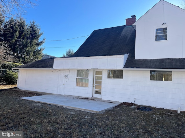 back of property with a patio area