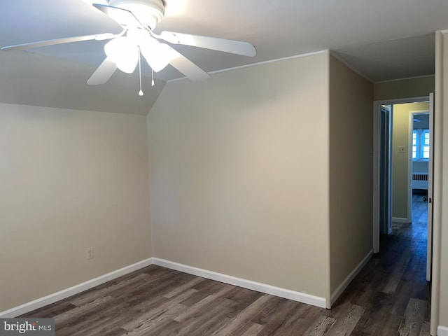 interior space with dark hardwood / wood-style flooring, radiator, and ceiling fan