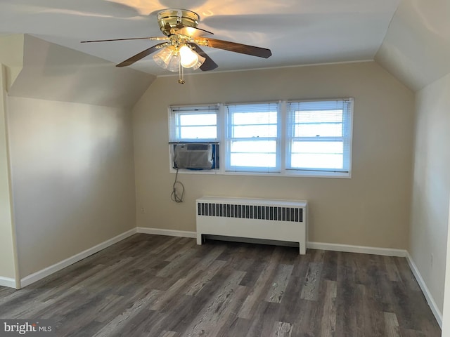 bonus room featuring lofted ceiling, radiator, ceiling fan, cooling unit, and dark hardwood / wood-style floors