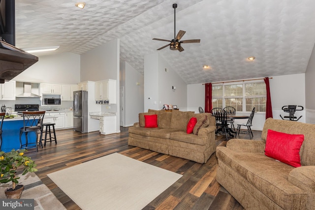 living room with dark wood-type flooring, ceiling fan, high vaulted ceiling, and a textured ceiling