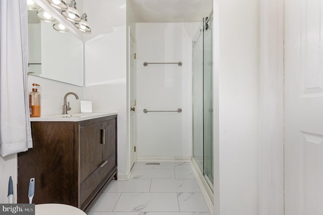 bathroom with vanity and an enclosed shower