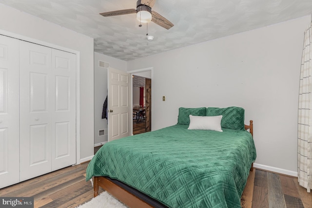 bedroom featuring ceiling fan, hardwood / wood-style floors, and a closet