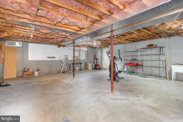 basement with brick wall