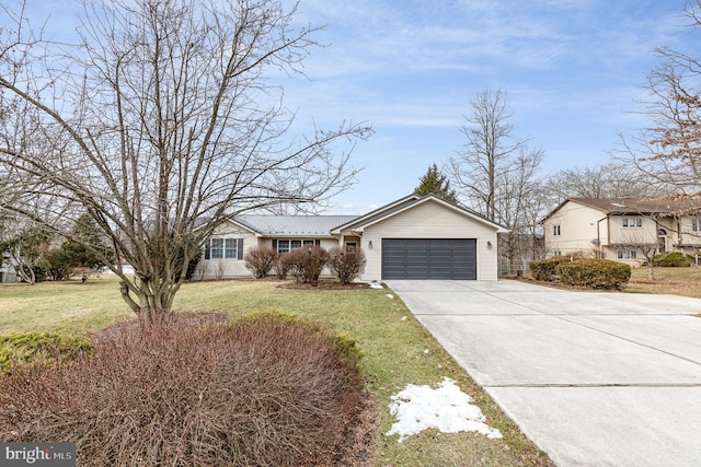 single story home featuring a garage and a front yard