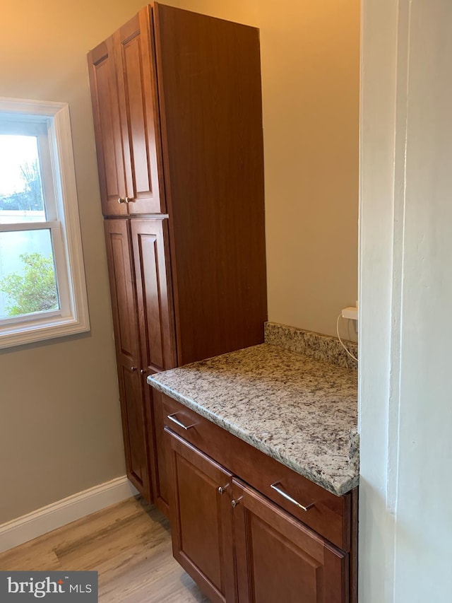 interior space featuring light hardwood / wood-style flooring and light stone countertops