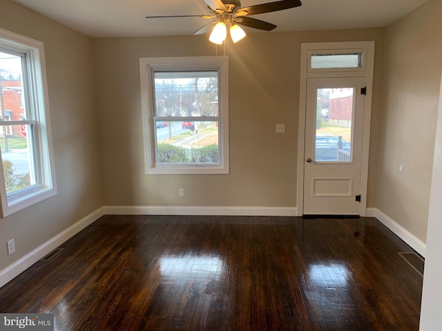 interior space featuring dark hardwood / wood-style flooring, plenty of natural light, and ceiling fan