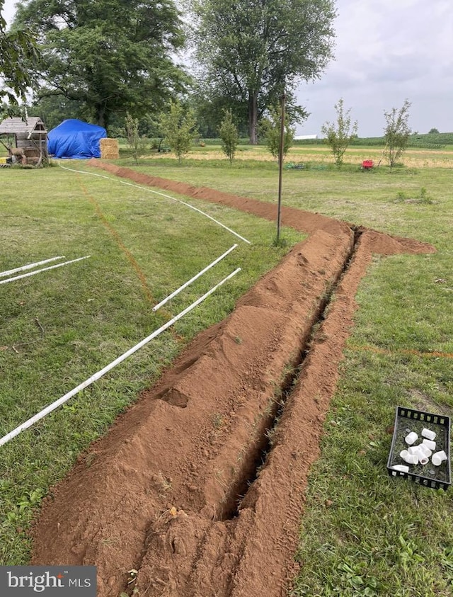 view of yard with a rural view