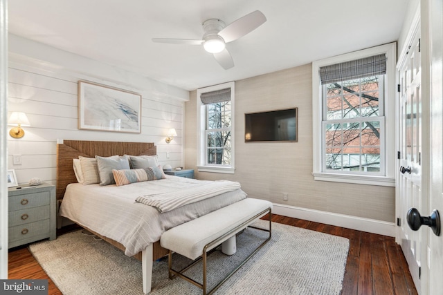 bedroom featuring dark hardwood / wood-style flooring and ceiling fan