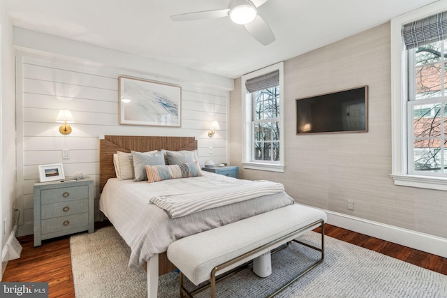 bedroom featuring ceiling fan and dark hardwood / wood-style flooring