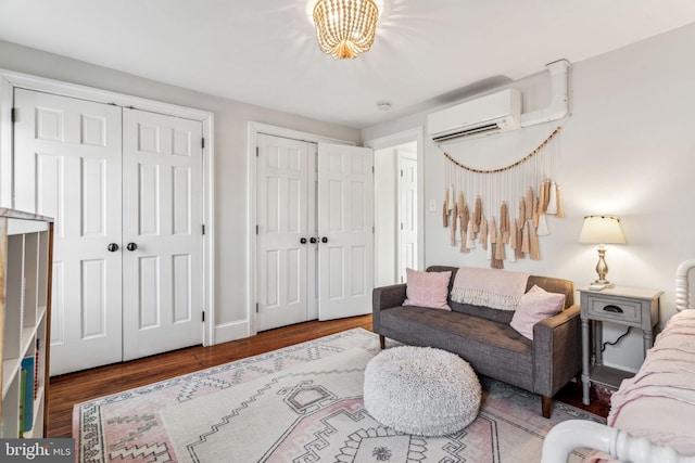 living room featuring hardwood / wood-style flooring and a wall mounted AC