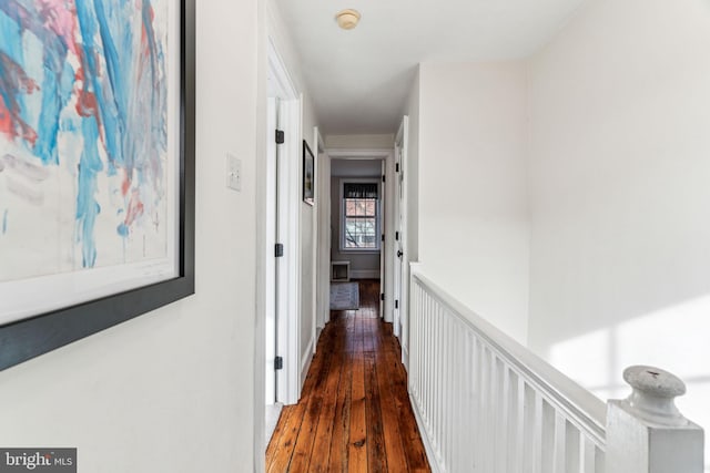 hallway with dark hardwood / wood-style floors