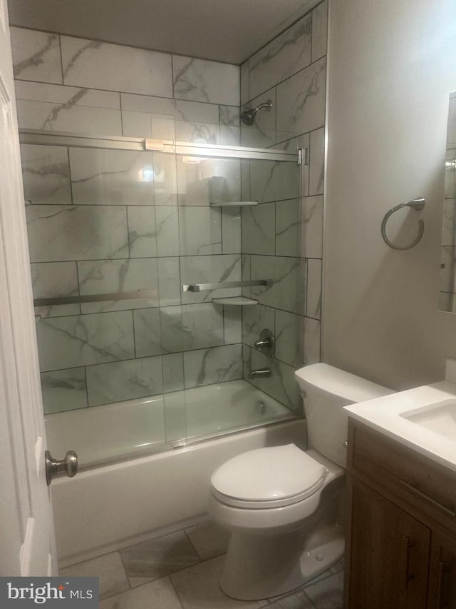 full bathroom with vanity, toilet, and combined bath / shower with glass door