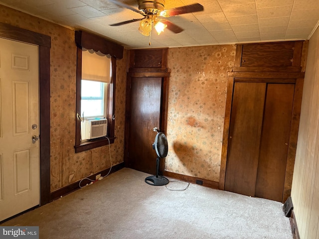 unfurnished bedroom with cooling unit, a closet, ceiling fan, and carpet flooring