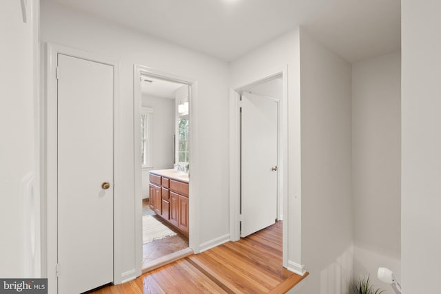 hall with light wood-type flooring