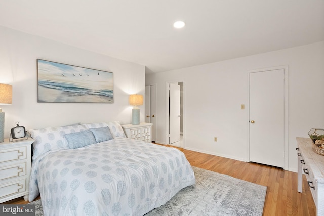 bedroom with light wood-type flooring