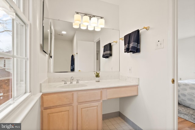 bathroom featuring vanity and a wealth of natural light