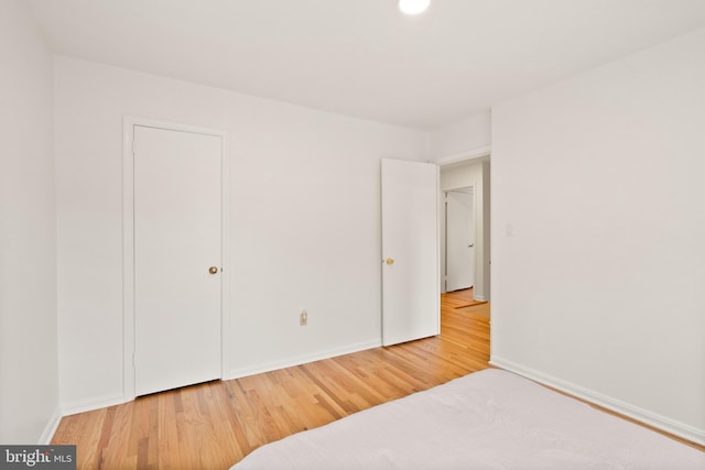 bedroom featuring hardwood / wood-style flooring