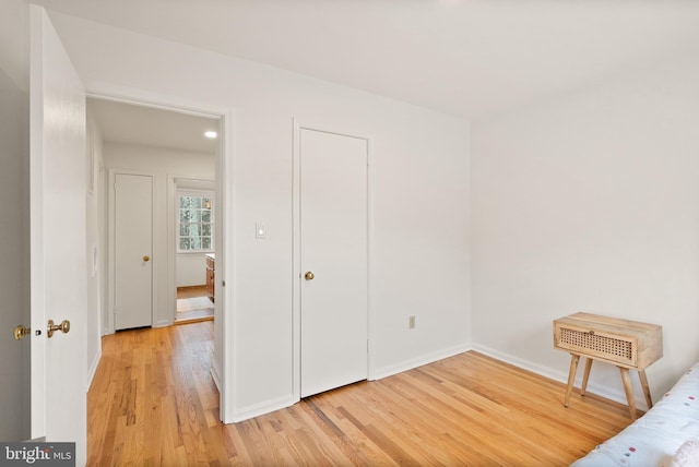 unfurnished bedroom with wood-type flooring