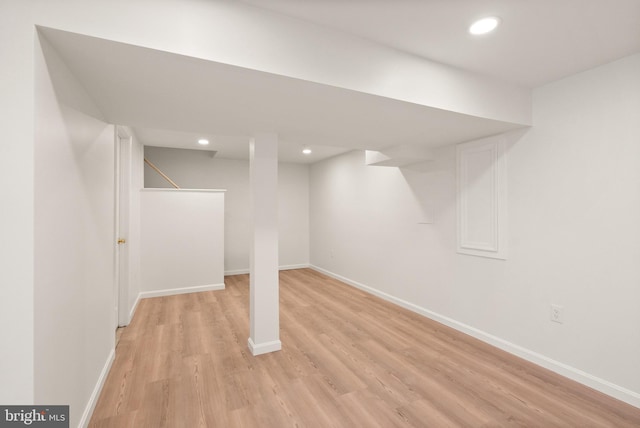 basement featuring light hardwood / wood-style floors